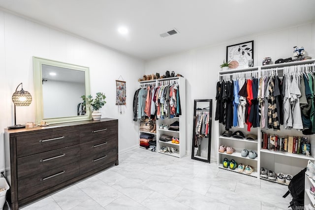 spacious closet with visible vents and marble finish floor