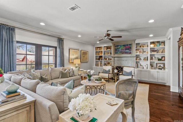 living room featuring dark wood-style floors, visible vents, crown molding, and a ceiling fan