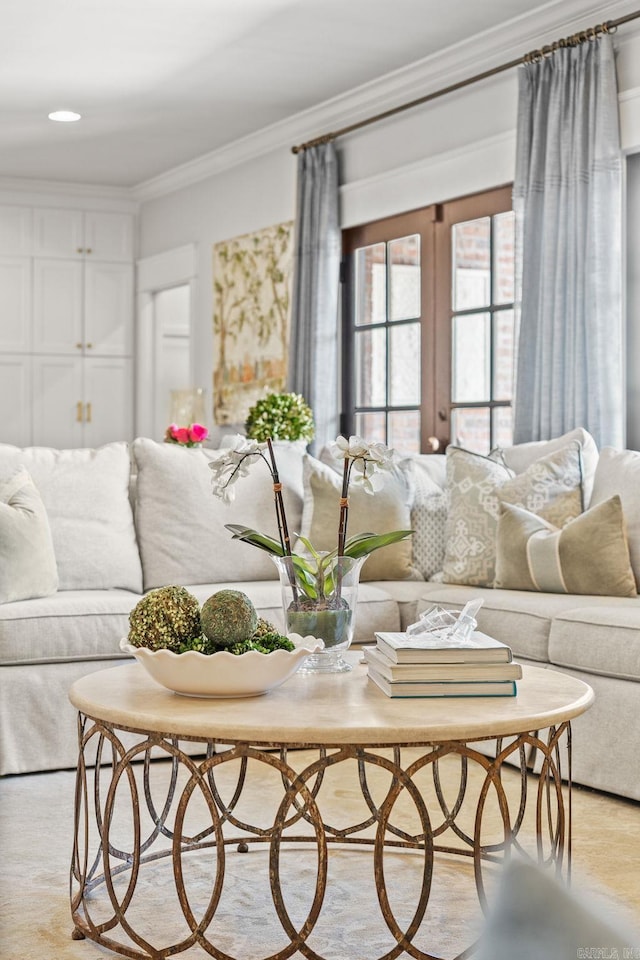 living room featuring crown molding