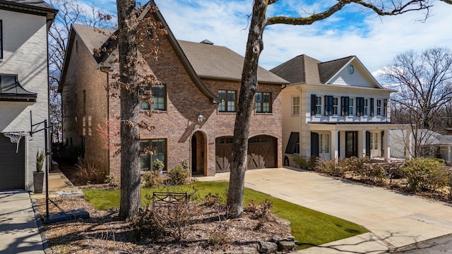 view of front of home featuring brick siding, concrete driveway, and a garage