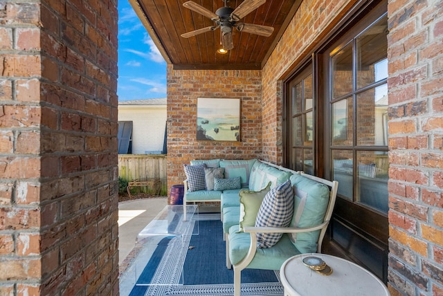 view of patio with an outdoor living space, ceiling fan, and fence