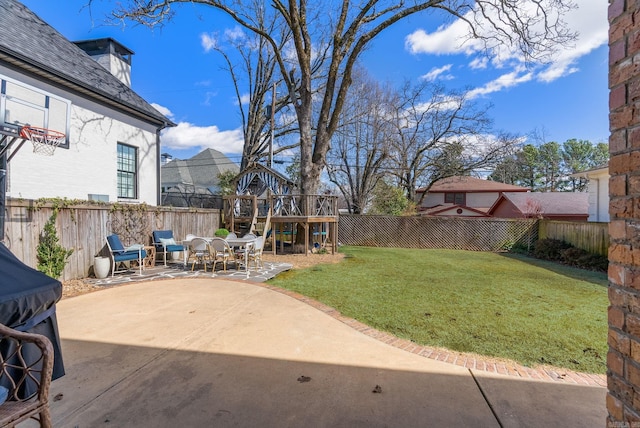 view of yard with a patio area and a fenced backyard