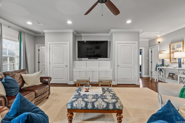 living room featuring recessed lighting, attic access, ornamental molding, and a ceiling fan