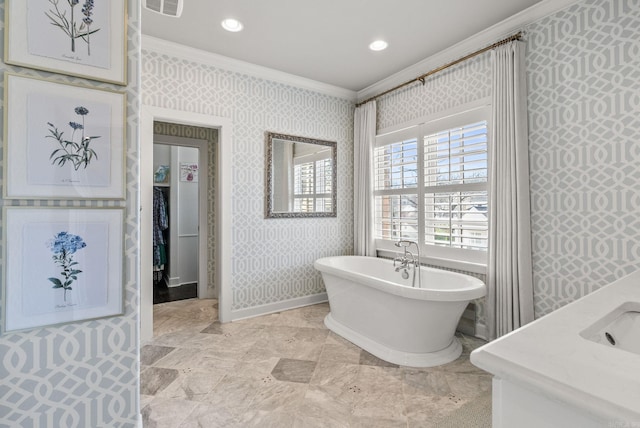 full bathroom with visible vents, a soaking tub, crown molding, and wallpapered walls