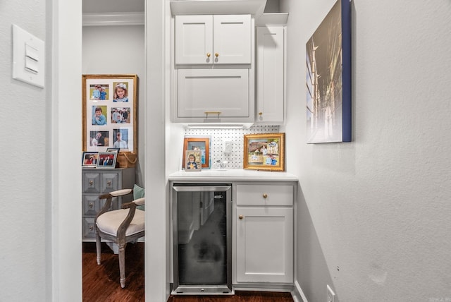 bar with baseboards, dark wood finished floors, wine cooler, a dry bar, and backsplash