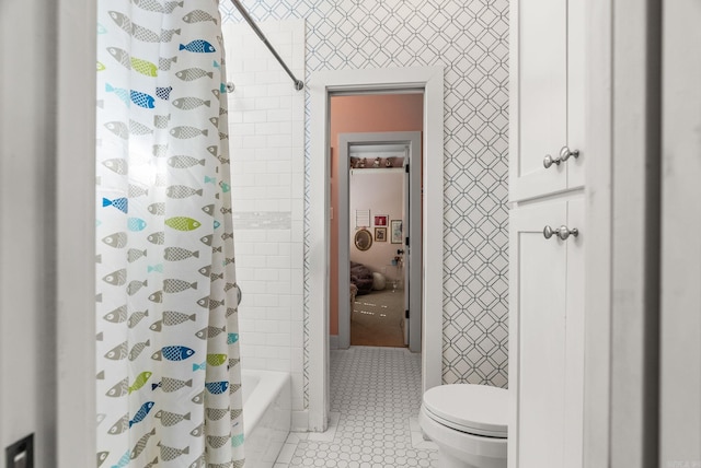 full bath featuring tile patterned flooring, shower / bath combination with curtain, and toilet