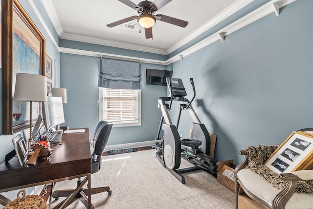 carpeted home office featuring a ceiling fan, visible vents, and ornamental molding