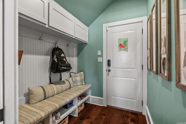 mudroom featuring baseboards, lofted ceiling, and dark wood-style flooring