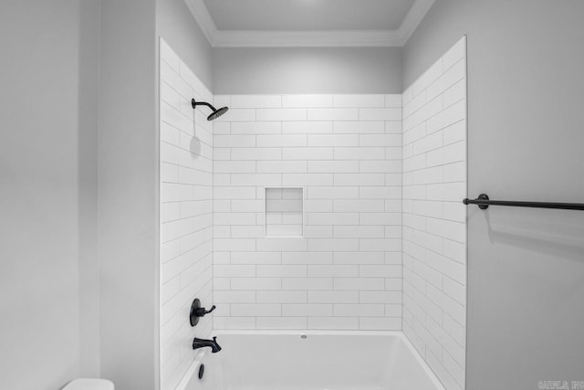 bathroom with crown molding, toilet, and shower / tub combination