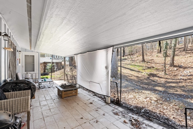 view of patio / terrace featuring an outdoor fire pit