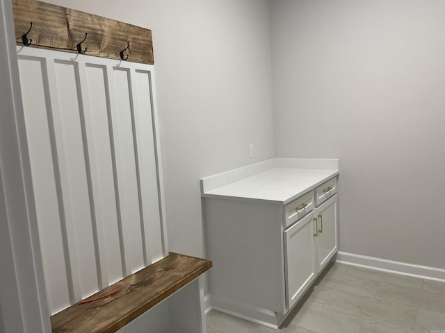 mudroom featuring baseboards