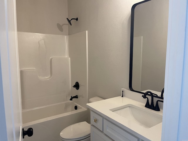 bathroom with toilet, vanity, and washtub / shower combination