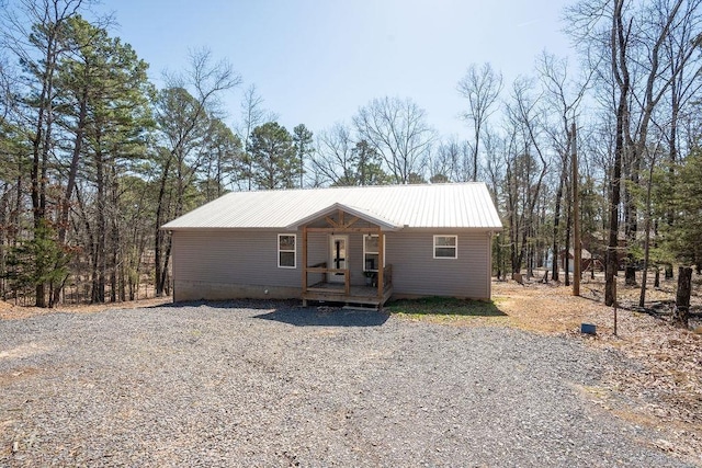 view of front of property with metal roof and a porch