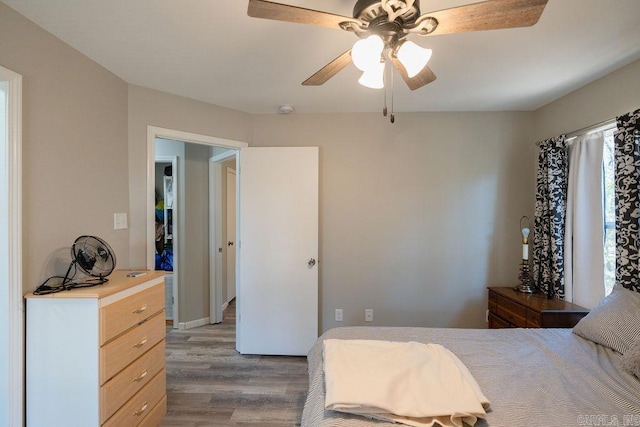 bedroom featuring a ceiling fan and wood finished floors