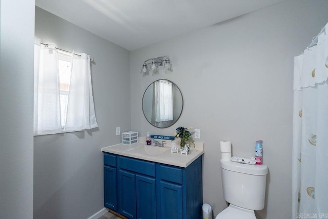 bathroom with toilet and vanity