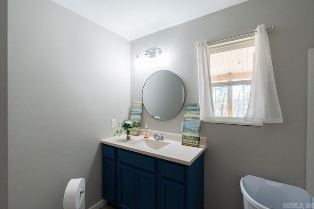 bathroom featuring toilet and vanity