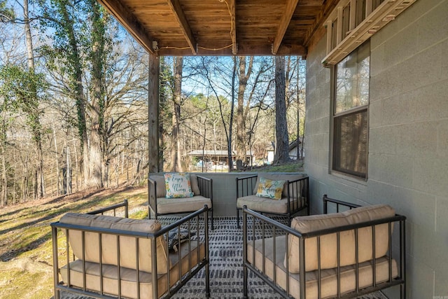 wooden terrace featuring an outdoor hangout area