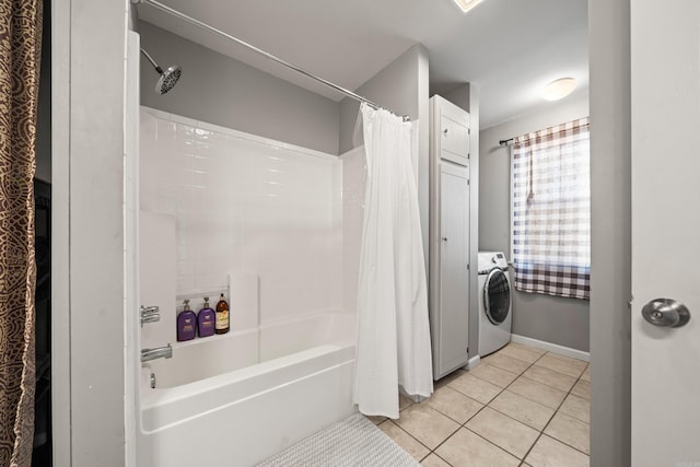 bathroom with baseboards, shower / bath combination with curtain, washer / dryer, and tile patterned flooring