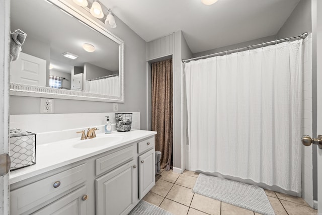 full bathroom with tile patterned flooring and vanity