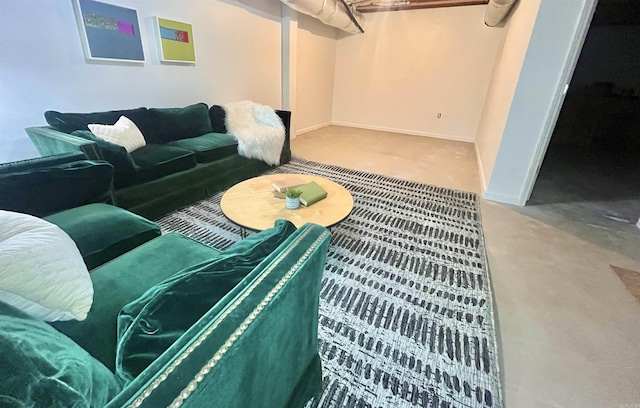 carpeted living room with baseboards