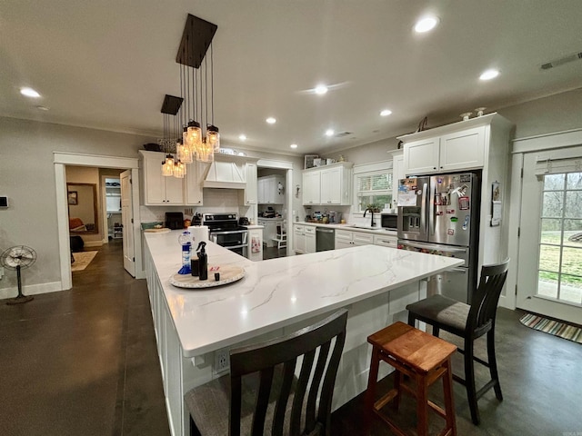 kitchen with visible vents, a notable chandelier, finished concrete flooring, white cabinetry, and stainless steel appliances