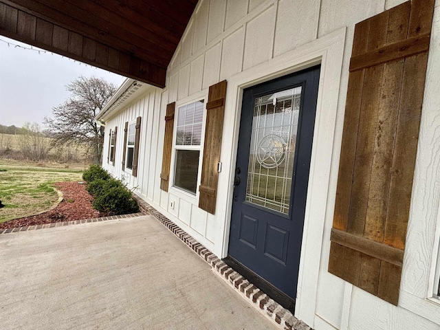 doorway to property with board and batten siding