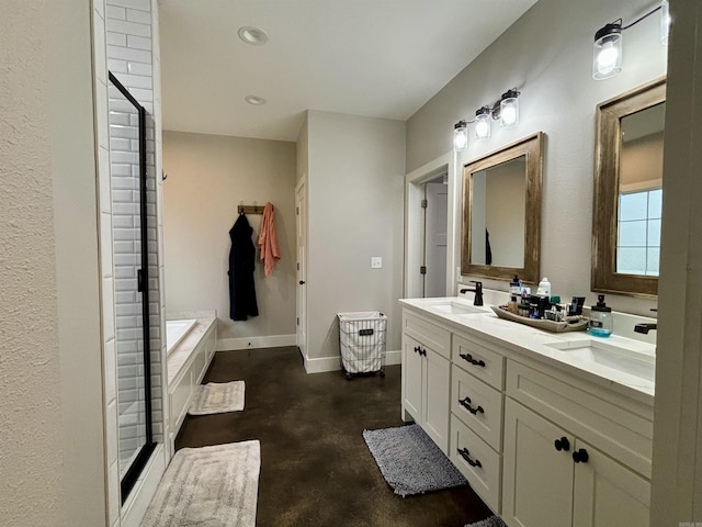 full bathroom featuring double vanity, a garden tub, baseboards, and a sink