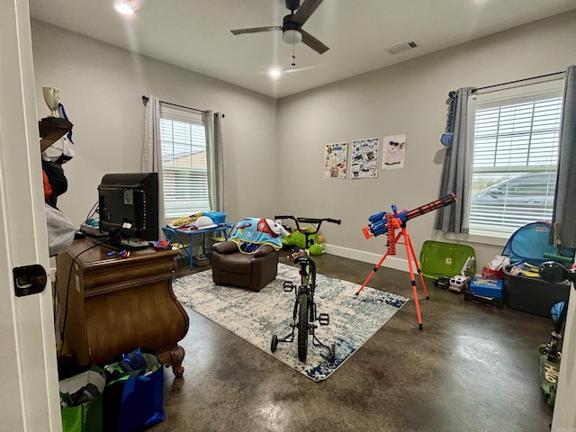 recreation room featuring visible vents, baseboards, concrete flooring, recessed lighting, and a ceiling fan