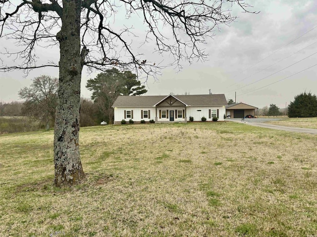 single story home with a garage and a front yard