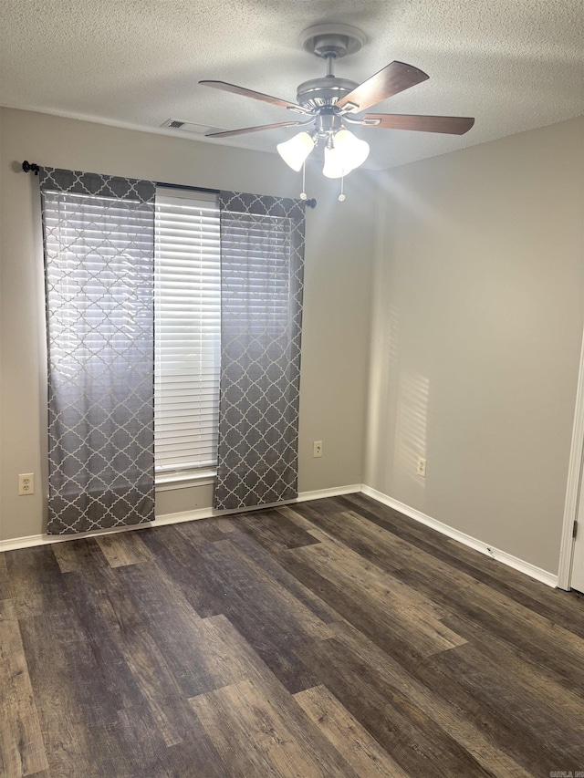 unfurnished room featuring a textured ceiling, ceiling fan, and wood finished floors