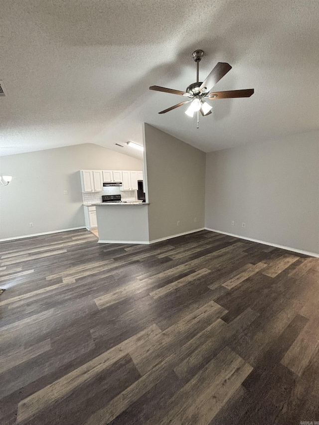 unfurnished living room featuring baseboards, dark wood-type flooring, ceiling fan, and vaulted ceiling