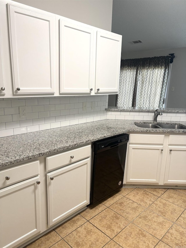 kitchen with dishwasher, tasteful backsplash, visible vents, and a sink