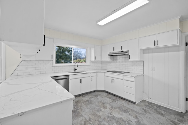 kitchen with light stone counters, a sink, under cabinet range hood, stainless steel dishwasher, and black electric stovetop