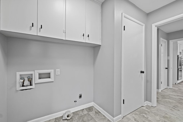 laundry area featuring electric dryer hookup, cabinet space, baseboards, gas dryer hookup, and hookup for a washing machine