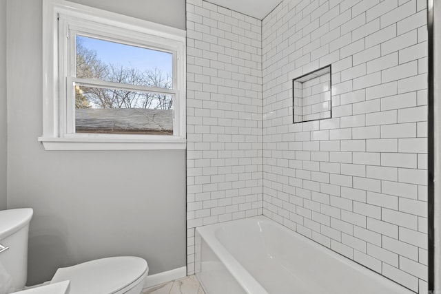 full bathroom featuring baseboards, toilet, marble finish floor, and  shower combination