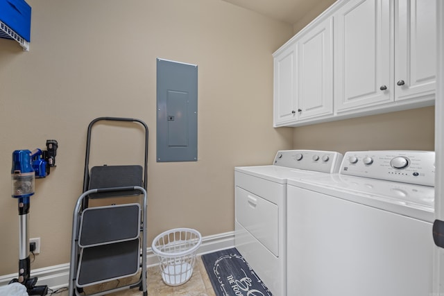 washroom with cabinet space, electric panel, washing machine and dryer, and baseboards