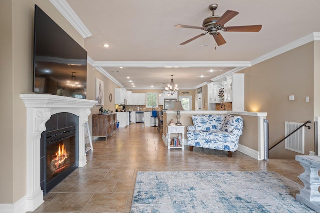 living area featuring visible vents, recessed lighting, ornamental molding, a tiled fireplace, and ceiling fan with notable chandelier