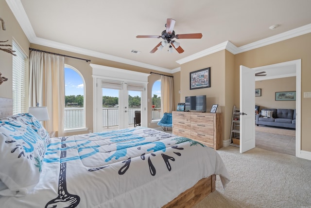 carpeted bedroom featuring visible vents, crown molding, baseboards, and access to outside