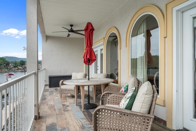 balcony with a ceiling fan and a mountain view