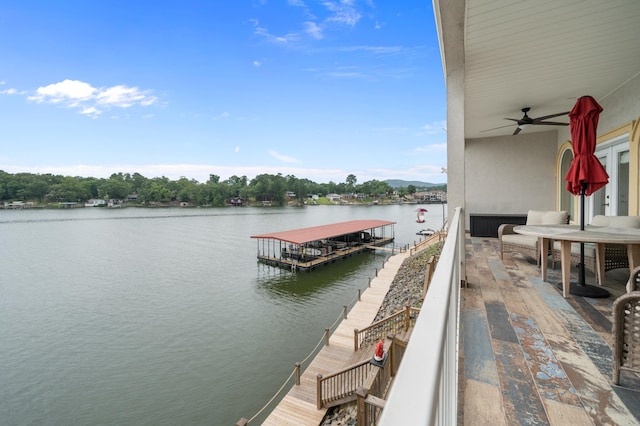 exterior space with a water view and a floating dock