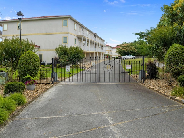 view of gate featuring fence