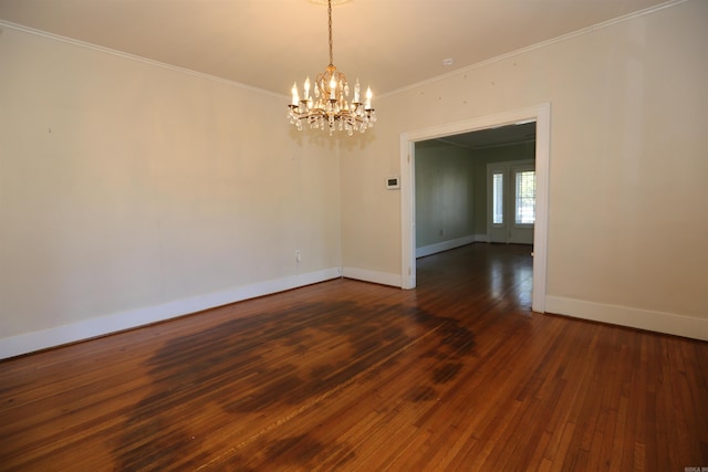 unfurnished room with dark wood-style floors, a chandelier, crown molding, and baseboards