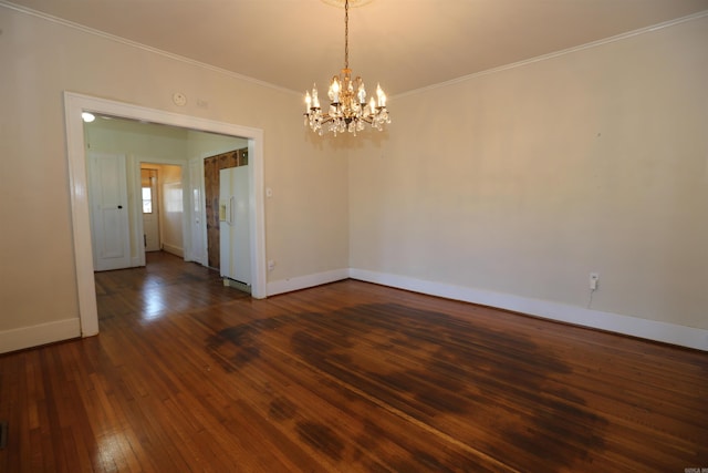 unfurnished room with baseboards, an inviting chandelier, dark wood finished floors, and crown molding