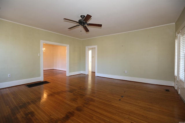 spare room featuring hardwood / wood-style floors, a ceiling fan, baseboards, and ornamental molding