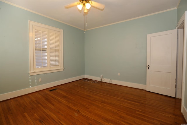 unfurnished room with hardwood / wood-style flooring, a ceiling fan, and crown molding