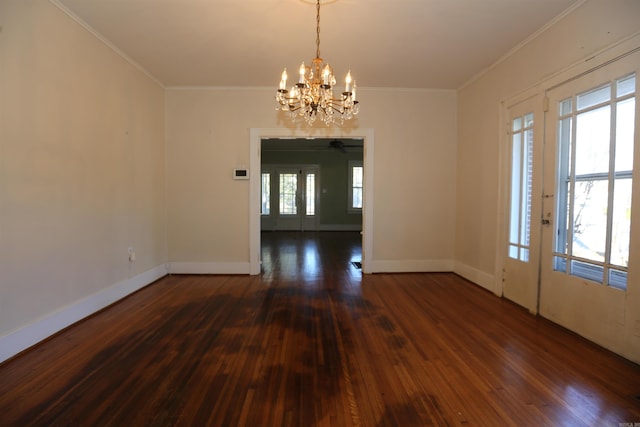 interior space with ceiling fan with notable chandelier, crown molding, baseboards, and dark wood-style flooring