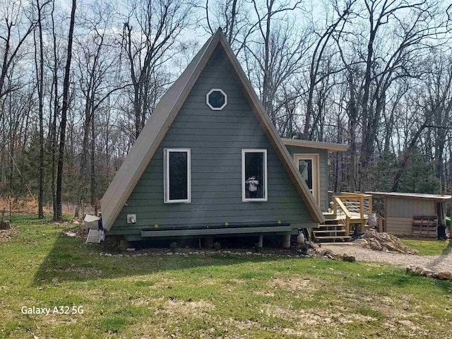 exterior space with a deck and a yard