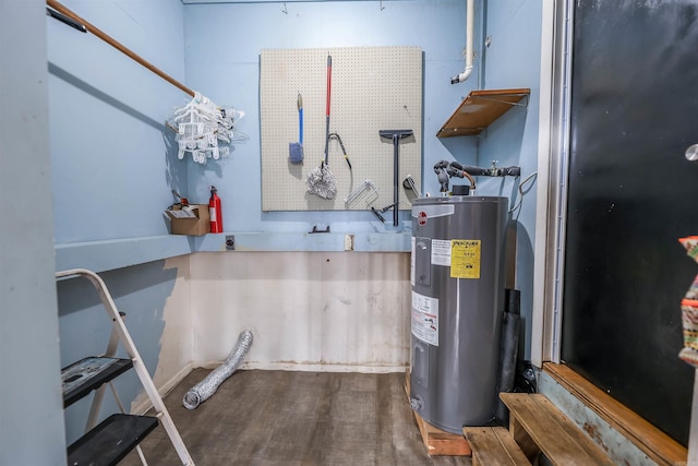 utility room with electric water heater