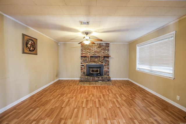 unfurnished living room with crown molding, baseboards, light wood finished floors, and ceiling fan