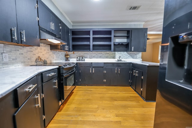 kitchen with black appliances, open shelves, visible vents, and under cabinet range hood